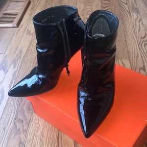 Patent leather ankle boots.